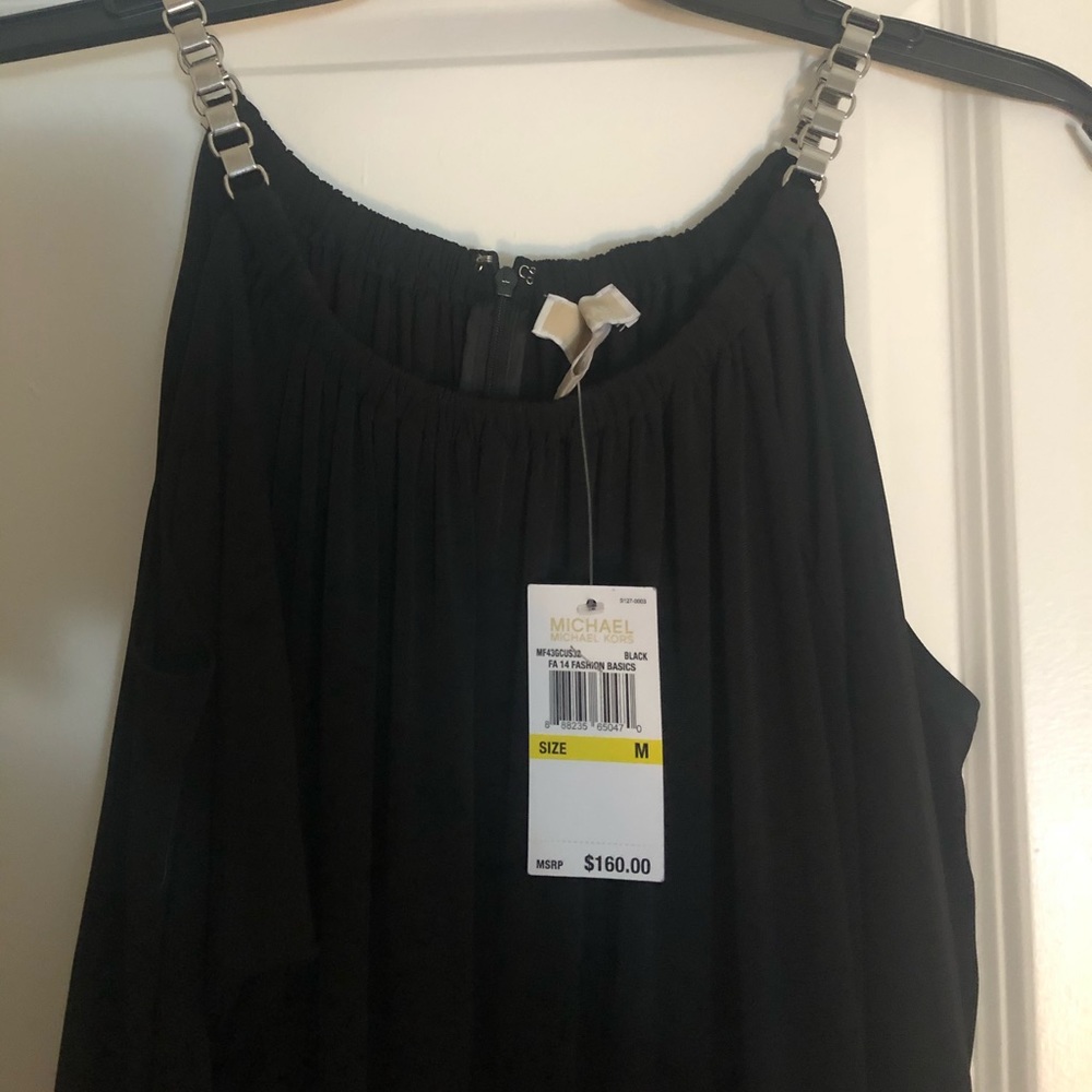 Elegant Michael Kors cold shoulder jumpsuit.